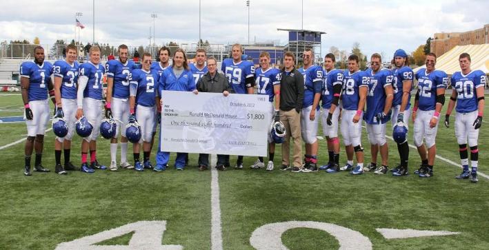Football donates $1,800 to Ronald McDonald House
