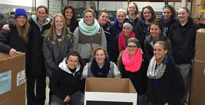 Women's Basketball Helps Soles For Jesus Packaging Shoes for Africa